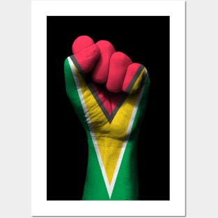 Flag of Guyana on a Raised Clenched Fist Posters and Art